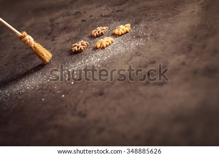 Cleaning sparkles between cookies. Shallow depth of field.