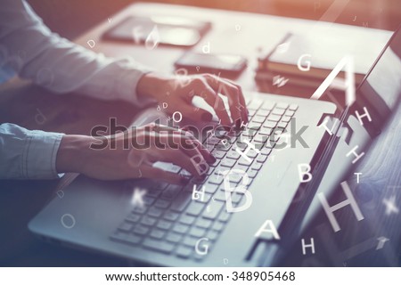 Working at home with laptop woman writing a blog. Female hands on the keyboard. Royalty-Free Stock Photo #348905468