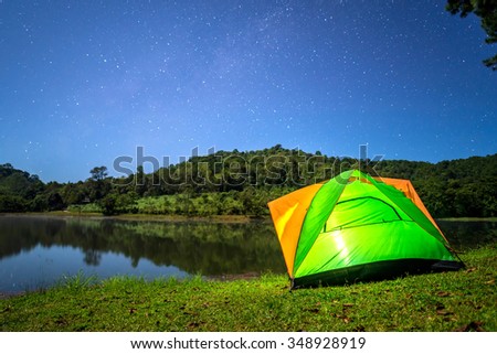 camping in forest at night with star