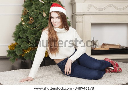 Beautiful Christmas. Bright picture of woman decorating christmas tree