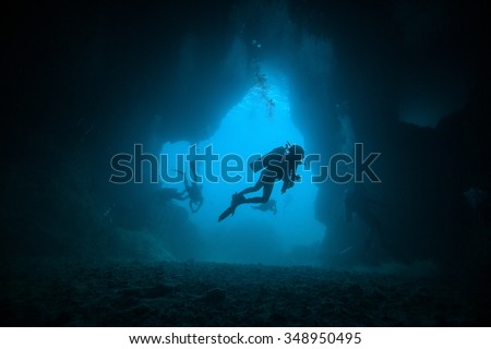 Underwater sea and  scuba divers Royalty-Free Stock Photo #348950495