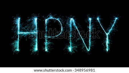 Happy New Year made of sparkles firework at night background