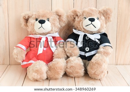 couple teddy bears on wood background, concept love