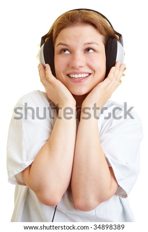 Happy nurse listening to music with headphones