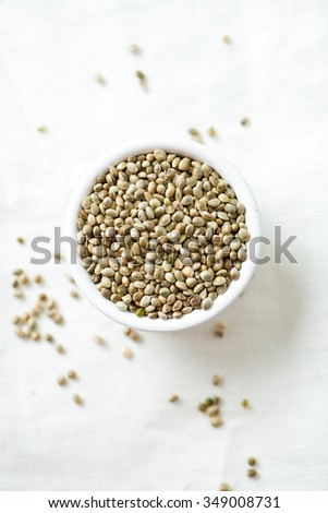 hemp seeds on wooden surface Royalty-Free Stock Photo #349008731