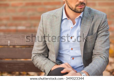 Fashion model man posing in autumn park. Smart casual outfit. Royalty-Free Stock Photo #349023344