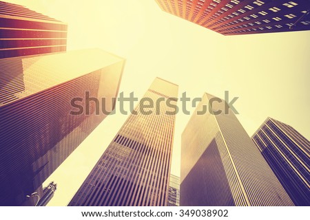 Vintage stylized photo of skyscrapers in Manhattan at sunset, New York City, USA.