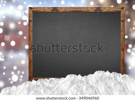 Blank blackboard with blurr city and snow 
