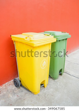 Large green and yellow wheelie bins for Recycle Materials