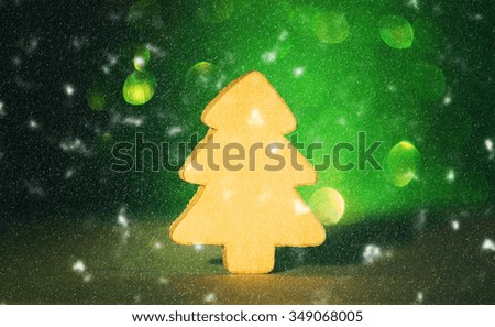 Decorative wooden christmas tree on glitter bokeh abstract background.