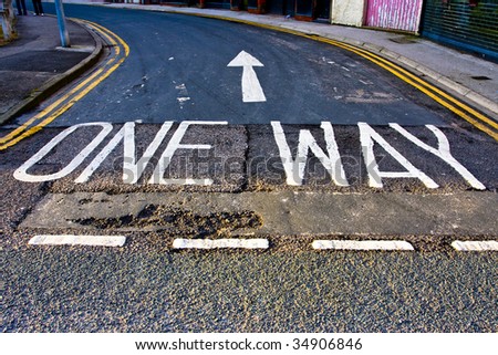 One way sign painted on road