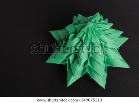 Origami Christmas tree on gray background