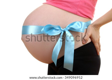 pregnant woman belly tied a blue ribbon on a white isolated background