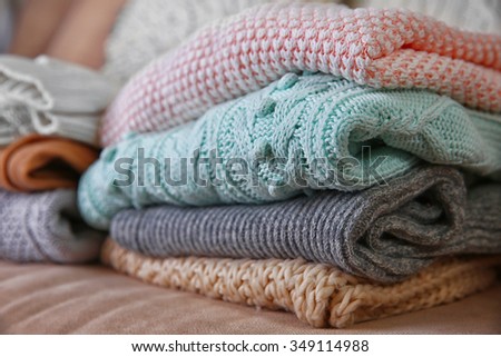 Knitted clothes on a sofa
