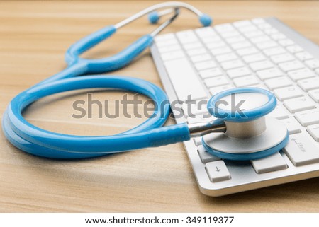 Doctors stethoscope and keyboard on the desk