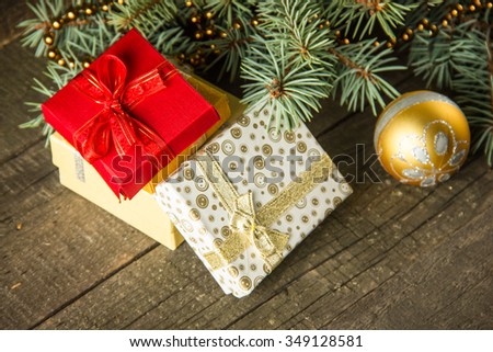Image of luxury New Year gifts, different present boxes under Christmas tree in holiday eve, Christmastime celebration, home decorated with festive shiny balls, magic x-mas night