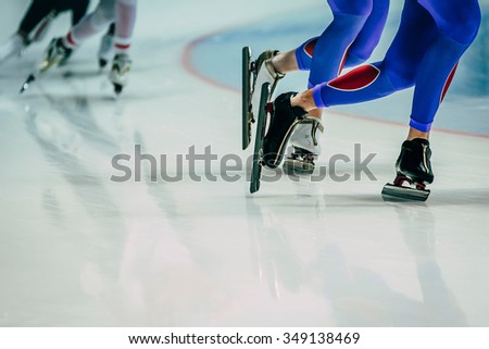 legs male skaters during warm-up before competitions in speed skating