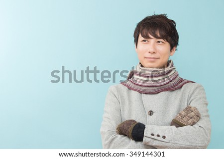 Japanese man wearing a coat.