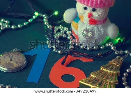 Fragment of Christmas decorations and lighted garland, close-up