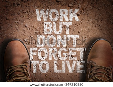 Top View of Boot on the trail with the text: Work But Don't Forget to Live Royalty-Free Stock Photo #349210850