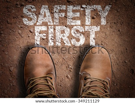 Top View of Boot on the trail with the text: Safety First Royalty-Free Stock Photo #349211129