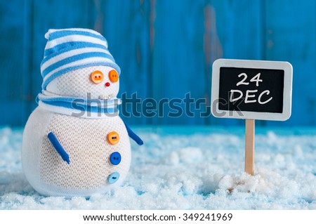 Christmas Eve Date On sign. December 24. Snowman near direction Sign. Xmas Decorations