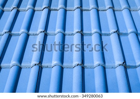 New blue roof with ceramic tiles closeup
