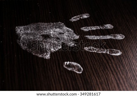 Hand print on black background