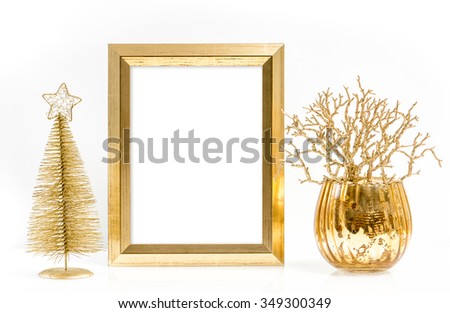 Golden picture frame and shiny christmas ornaments. Festive decoration