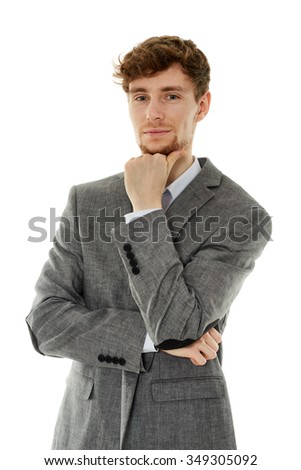 Handsome businessman with hand on chin isolated on white