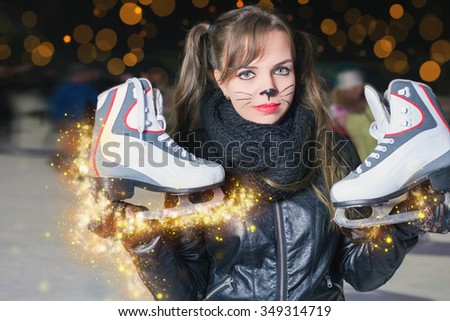 Pretty young woman dressed in cat fancy dress holding skates shoes. Healthy lifestyle and Halloween! Horror and magic holiday night.  Holiday makeup.