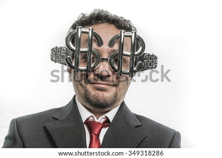 humorous, businessman with funny face and glasses-shaped silver dollar