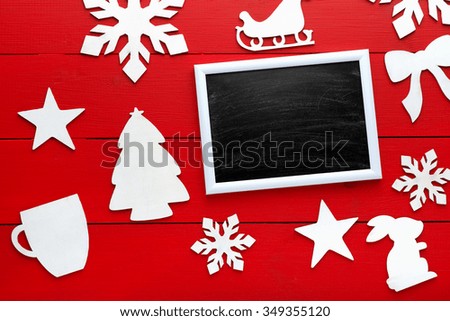 Beautiful wooden christmas background with wooden icons of snowflakes, Christmas trees, stars. New Year's holidays. Insert text. Christmas decorations. Wooden board rustic