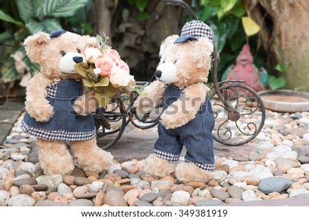 couple teddy bears with roses on garden background,  two teddy bear picnic in garden love concept vintage style