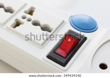 Multiple electrical plugs on white