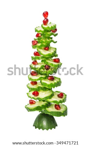 New Year's (Christmas) fir-tree from the figured cut cucumbers and pomegranate, dietary, vegetarian,  isolated on the white