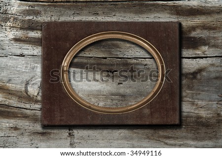 blank frame on old wooden background