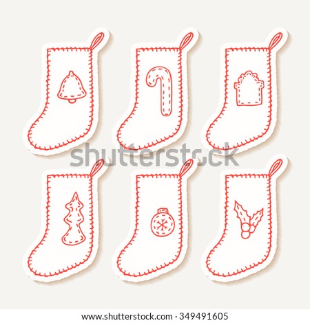 Set of hand drawn outline christmas sock stickers with different sewn decorations for your design. Doodle holiday clip art. Vector illustration