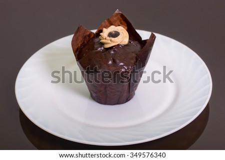 muffin with butter cream on white plate