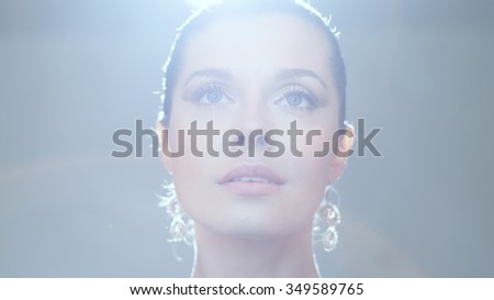Girl looking up in back-light 