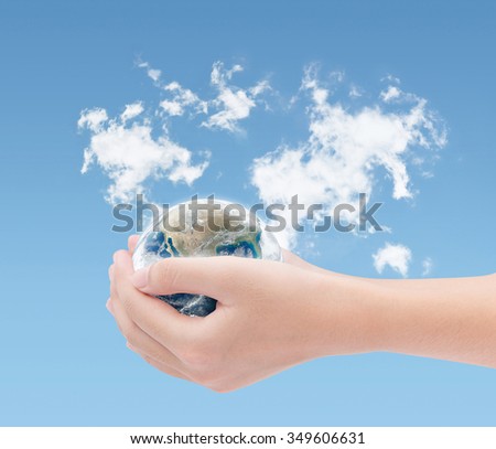 Hand holding earth on world clouds map background ,Elements of this image furnished by NASA,Earth Day concept