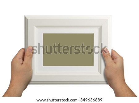 man's hand holding a wooden box isolated on white background. close up