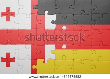 puzzle with the national flag of georgia and germany . concept