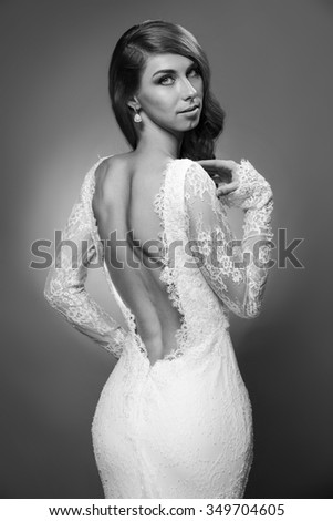 portrait of beautiful woman in wedding dress isolated over white background