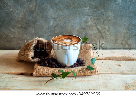 Picture of coffee cup merry x' mas top view on old wooden
