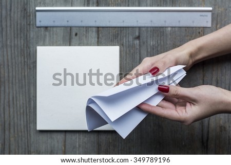 Woman's hand a sheet of paper 