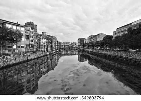 Spain, black and white photo overlooking the town from the river