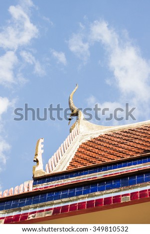 The roof top of thai temple on blue sky background