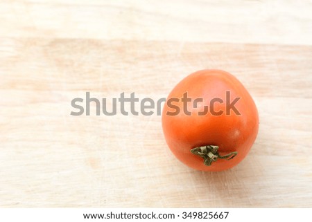 Tomatoes on the wooden floor