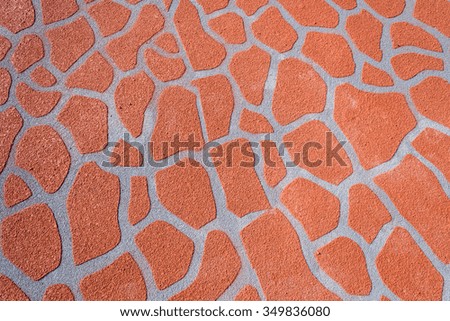 orange cement paint in giraffe pattern on road